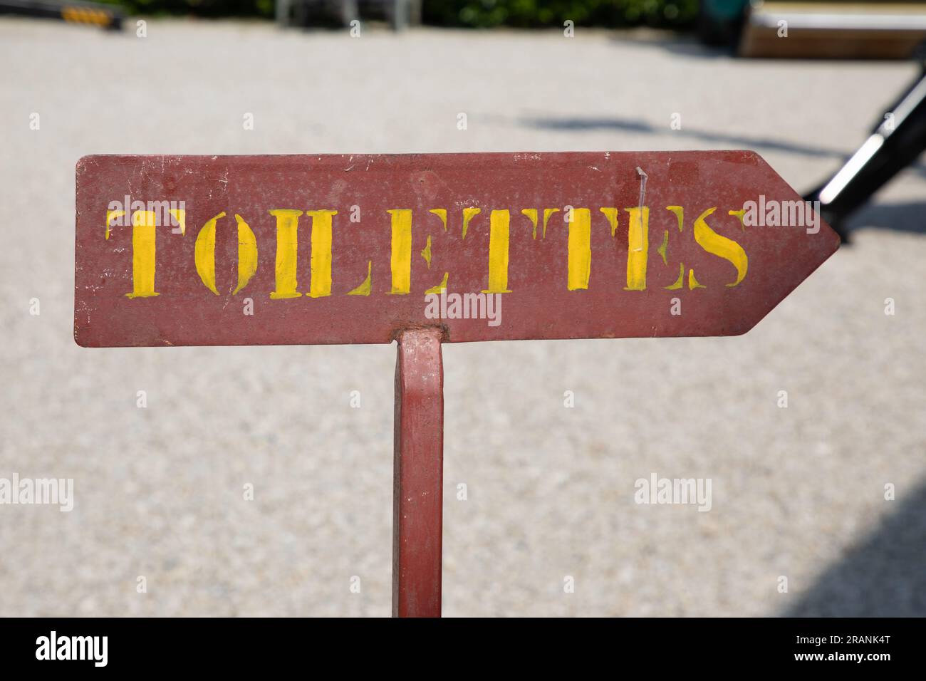 Toilettes french text means wc Toilet sign on wooden arrow water