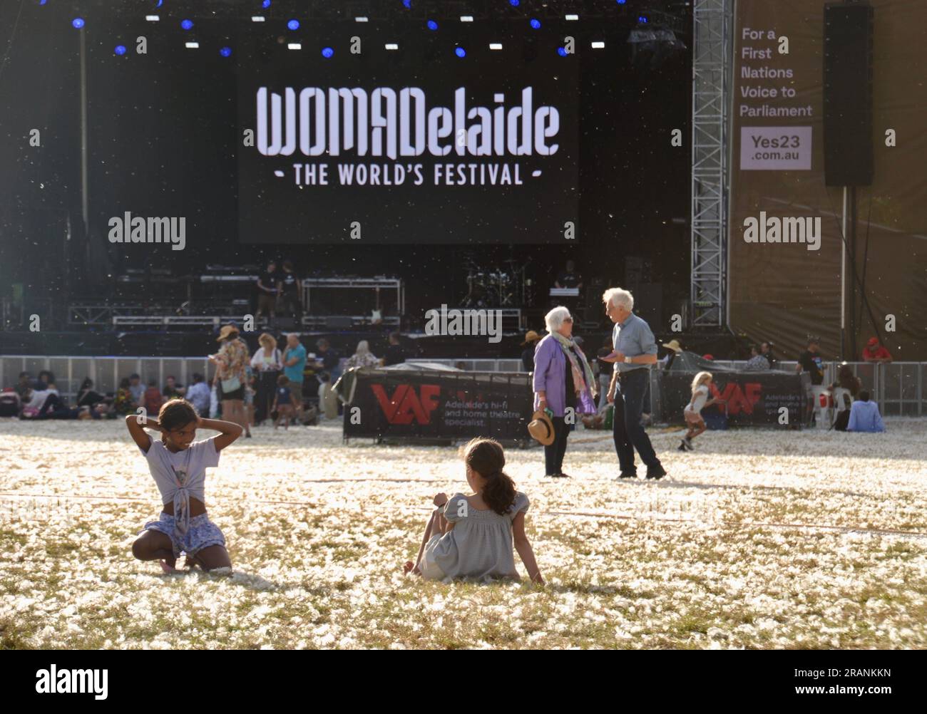 A field full of white feathers in front of the main stage at the WOMAD music festival in Adelaide between band or acts Stock Photo
