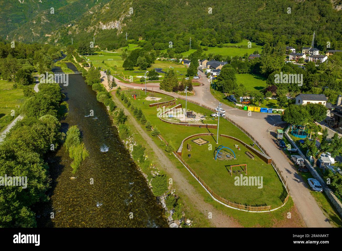 Aerial view of the children's area of the town of Barruera next to the Noguera de Tor river, in the Boí Valley (Lleida, Catalonia, Spain, Pyrenees) Stock Photo