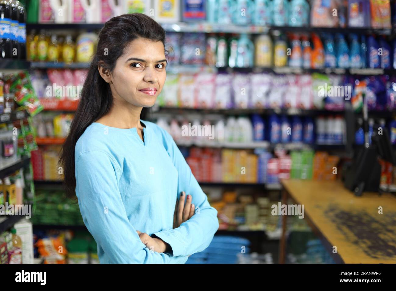 Portrait of Happy and smiling Indian girl purchasing in a grocery store. Buying grocery for home in a supermarket. Stock Photo