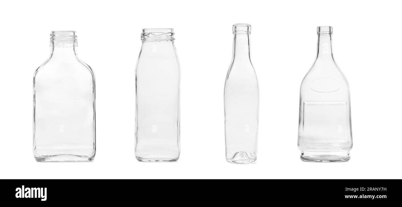 Set of empty glass transparent bottles for alcoholic and non-alcoholic drinks, isolated on white background. Glassware. Stock Photo