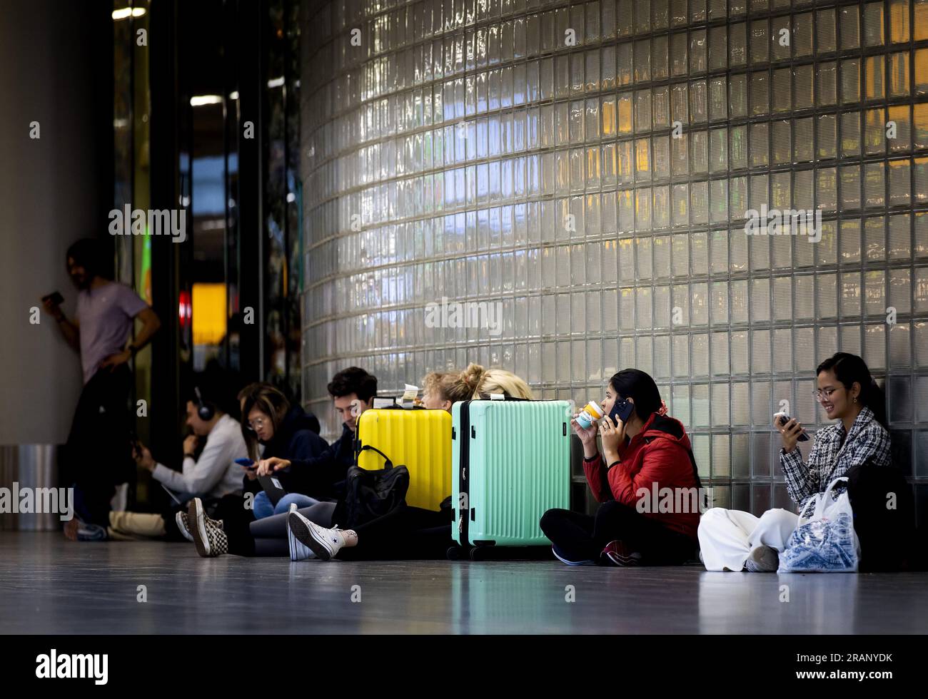 SCHIPHOL Travelers at Schiphol Airport. Only very limited air traffic