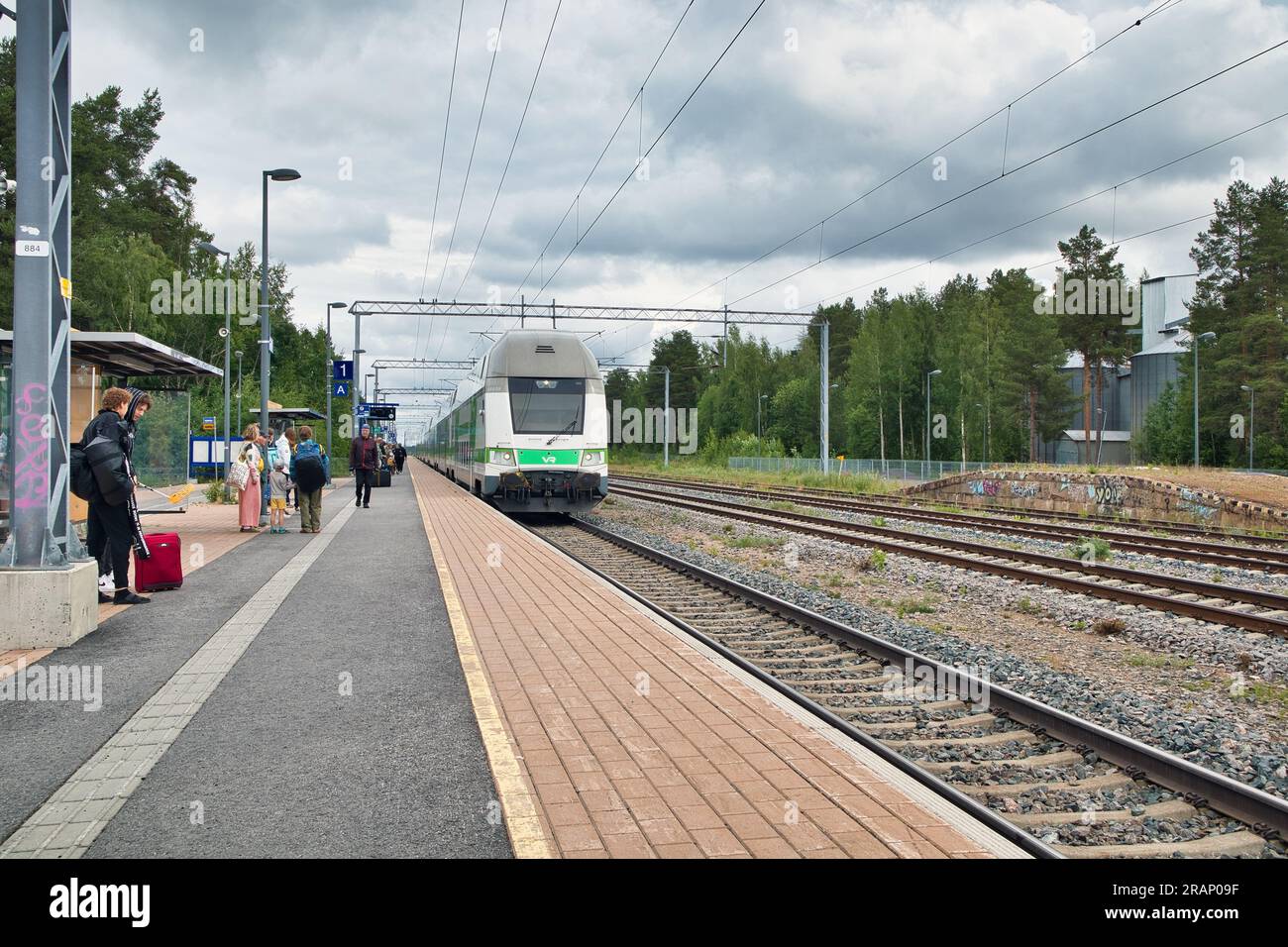 Intercity train arriving at the Kempele railway station, Finland Stock Photo
