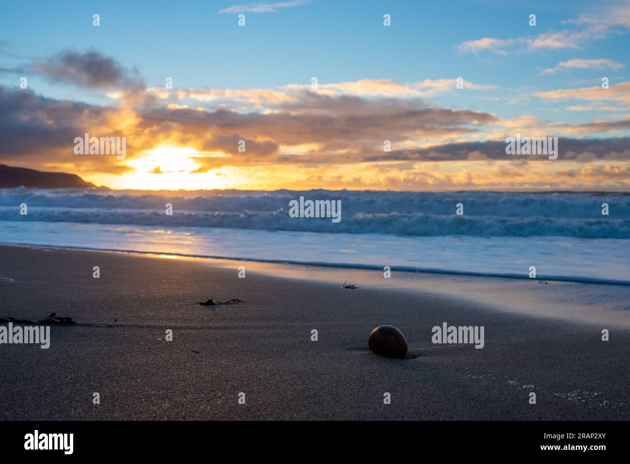 Dramatic sunset on Widemouth Beach in Cornwall, UK Stock Photo