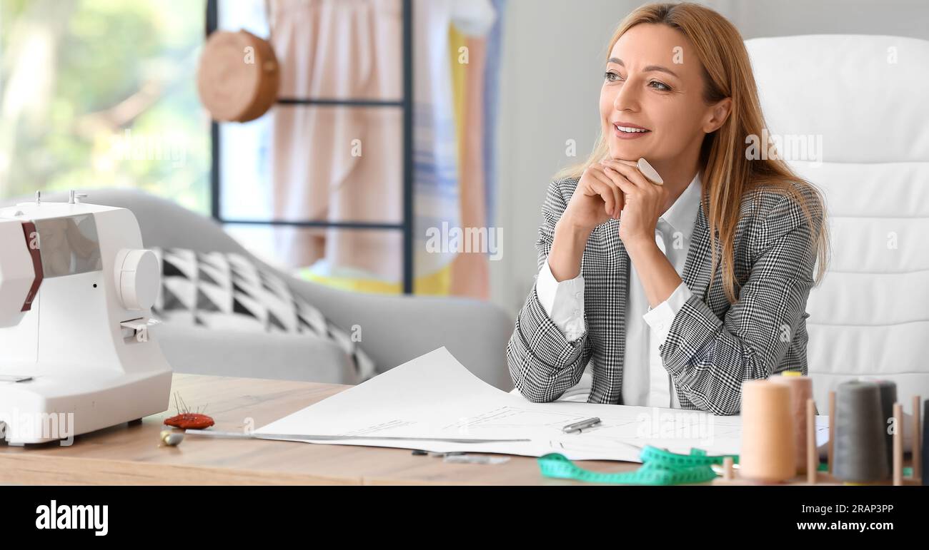 Female tailor in modern studio Stock Photo - Alamy