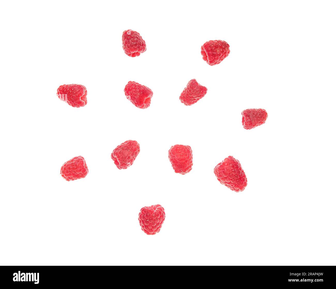 Flying fresh raspberry on white background Stock Photo - Alamy