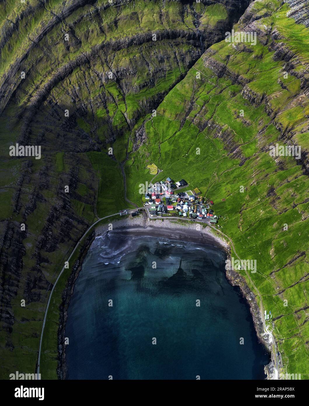 Aerial view of the Tjornuvik village and its beach located at a beautiful bay in the Faroe Islands, Denmark. Stock Photo