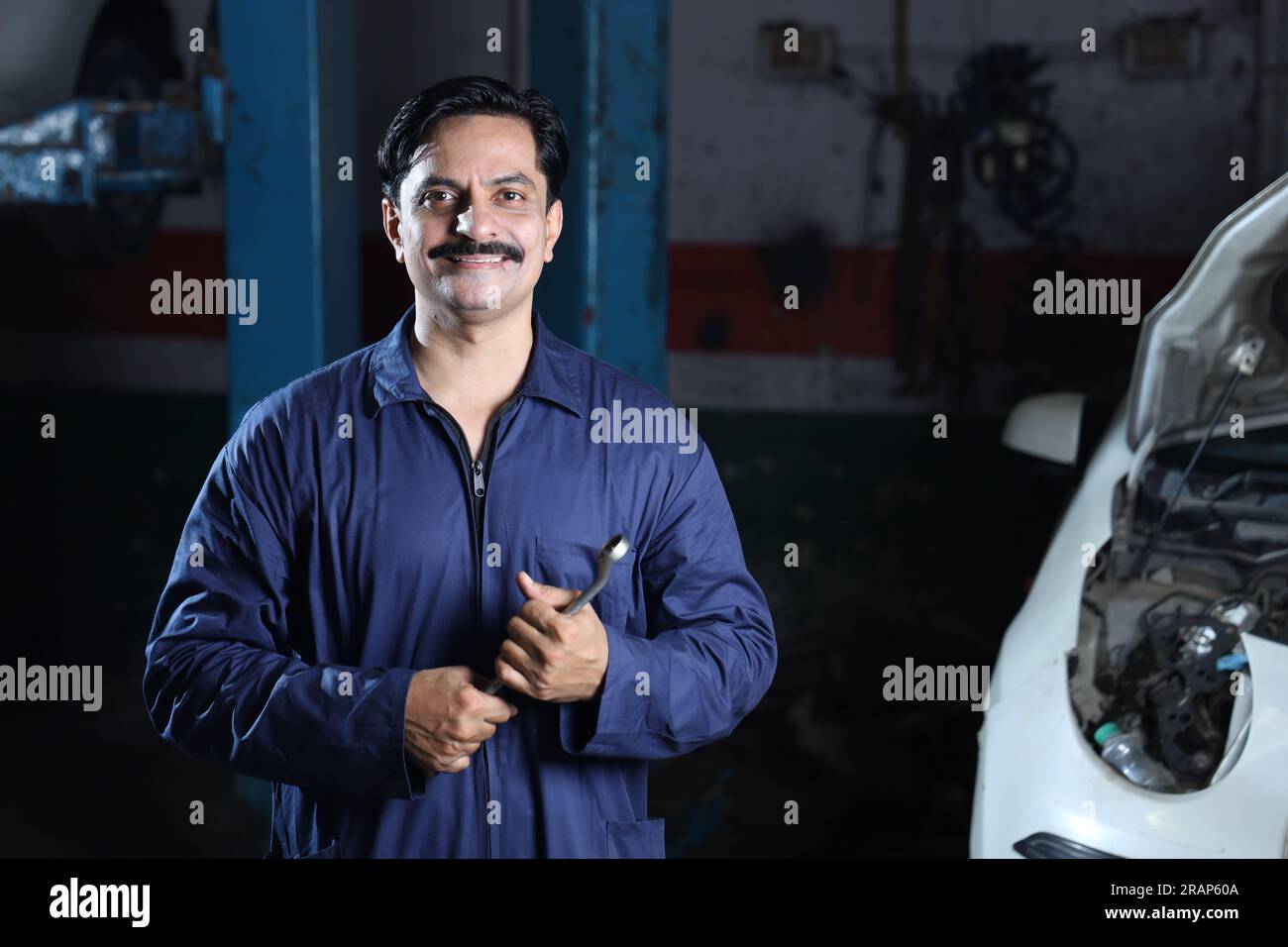Mechanic in garage repairing gearbox hi-res stock photography and ...
