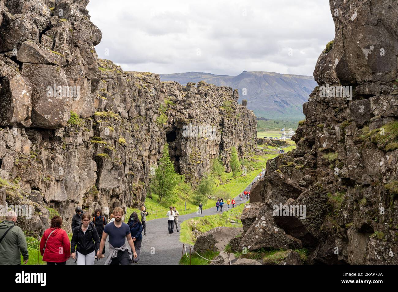 Thingvellir rift valley, Iceland - 06.26.2023: Tourists walking on continental rift between the North American and Eurasian tectonic plates in Iceland Stock Photo
