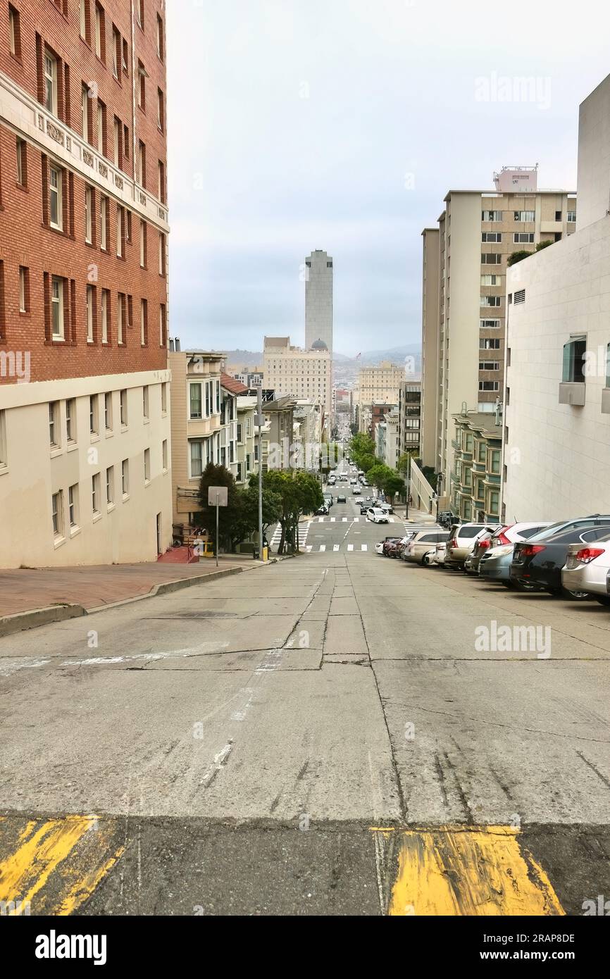 View downhill of typical street with parked cars Pine Street San