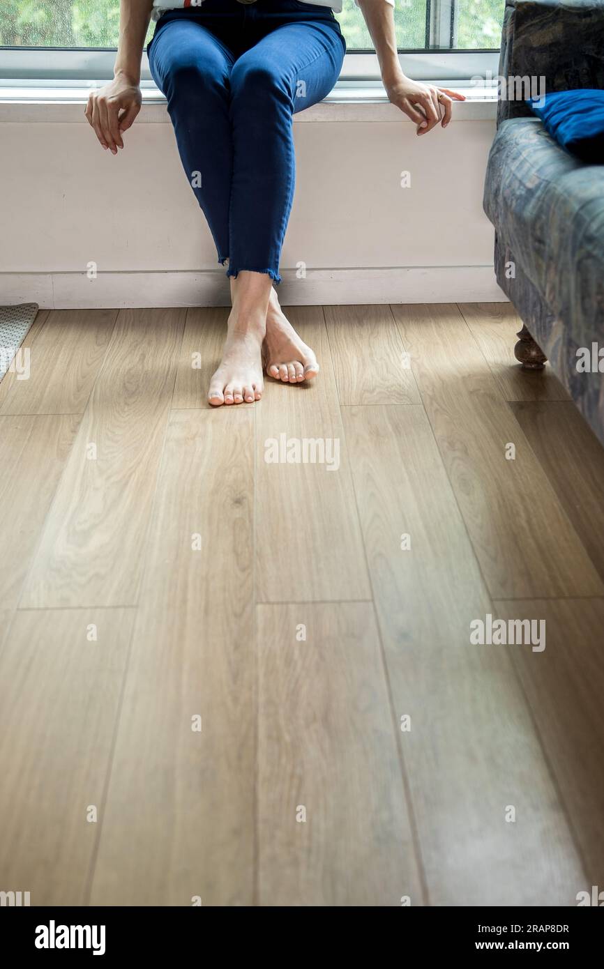 Barefoot woman resting feet on hi-res stock photography and images - Alamy