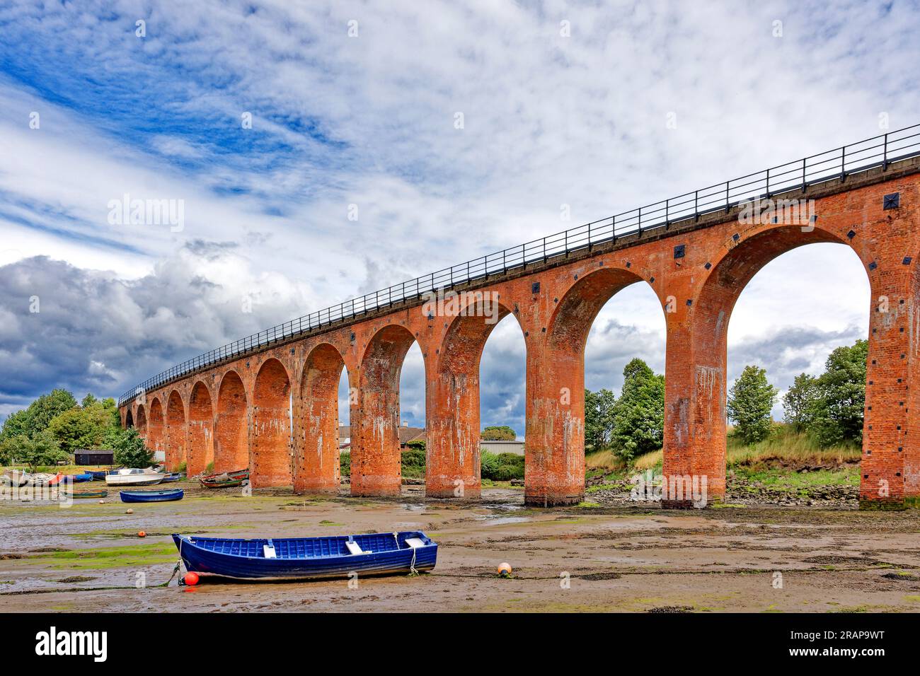 Ferryden Viaduct Montrose Basin Scotland  the 17 red-brick semi-circular arches seen at low tide Stock Photo