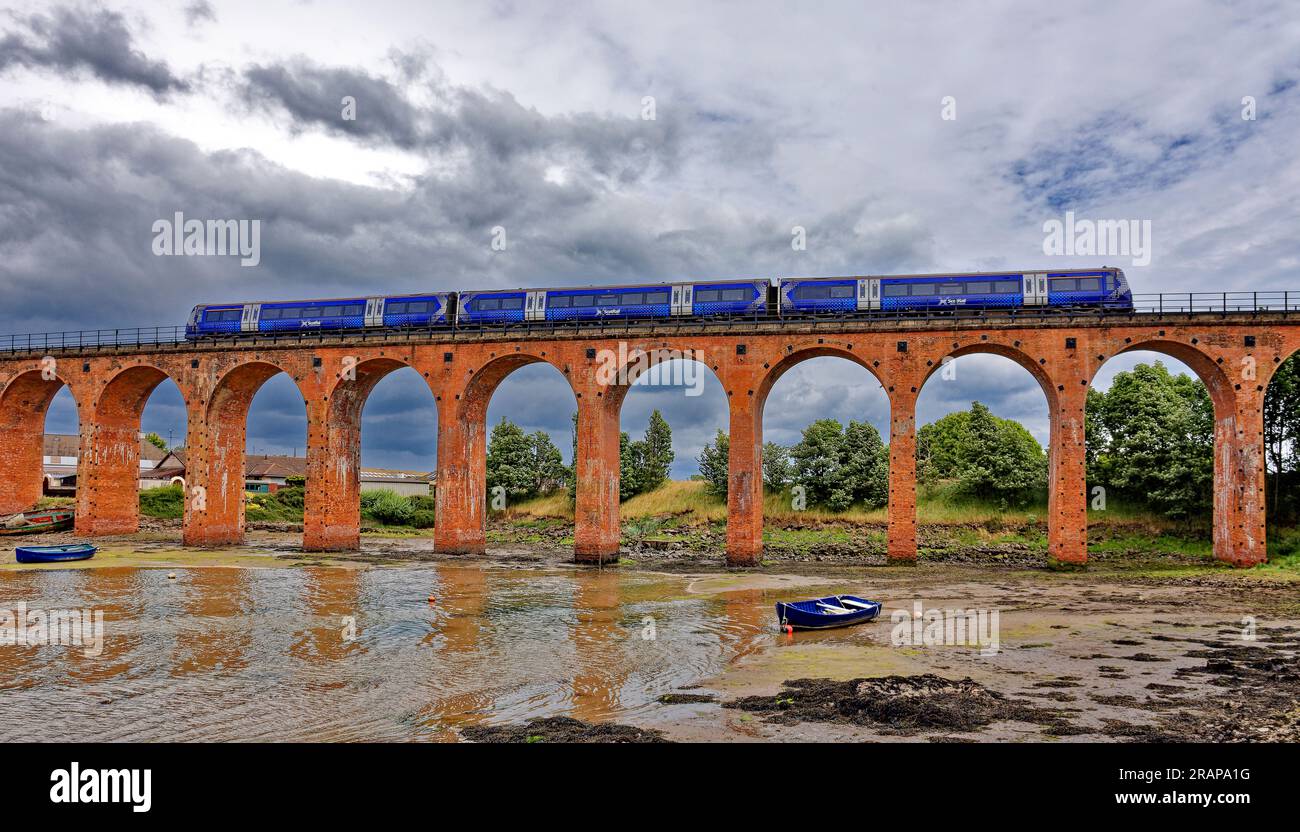 Ferryden Viaduct Montrose Basin Scotland ScotRail Passenger Diesel Train crossing the 17 red-brick semi-circular arches Stock Photo