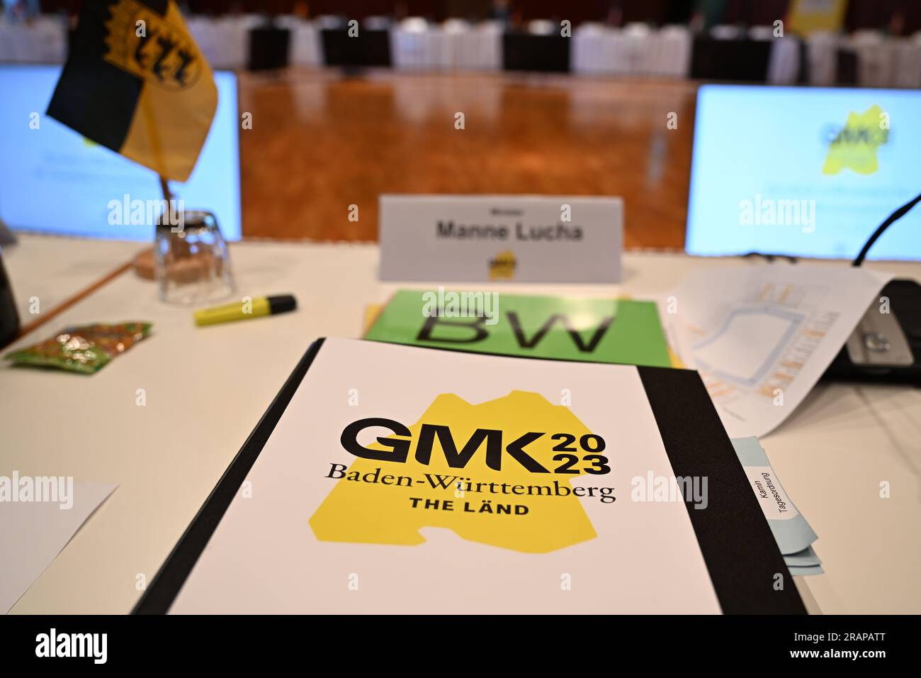 Friedrichshafen, Germany. 05th July, 2023. On the desk of Manfred Lucha (Greens), Baden-Württemberg's Minister of Health, are some documents at the start of the main conference of health ministers at Lake Constance. Credit: Felix Kästle/dpa/Alamy Live News Stock Photo