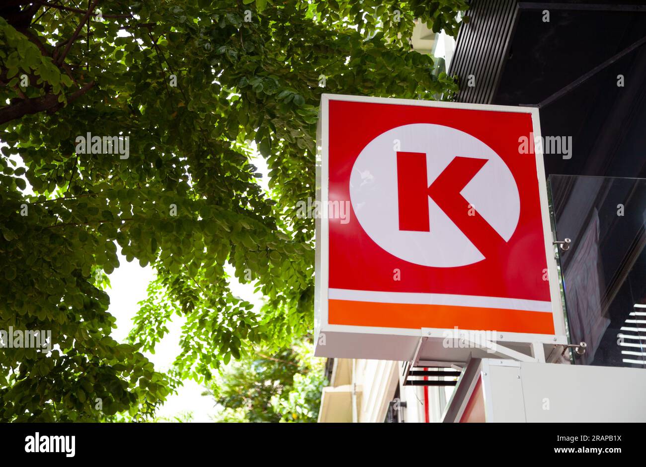Ho Chi Minh City, Vietnam - June 4, 2023: International convenience store chain Circle K logo on a commercial sign. Red square lightbox advertisement - Stock Image