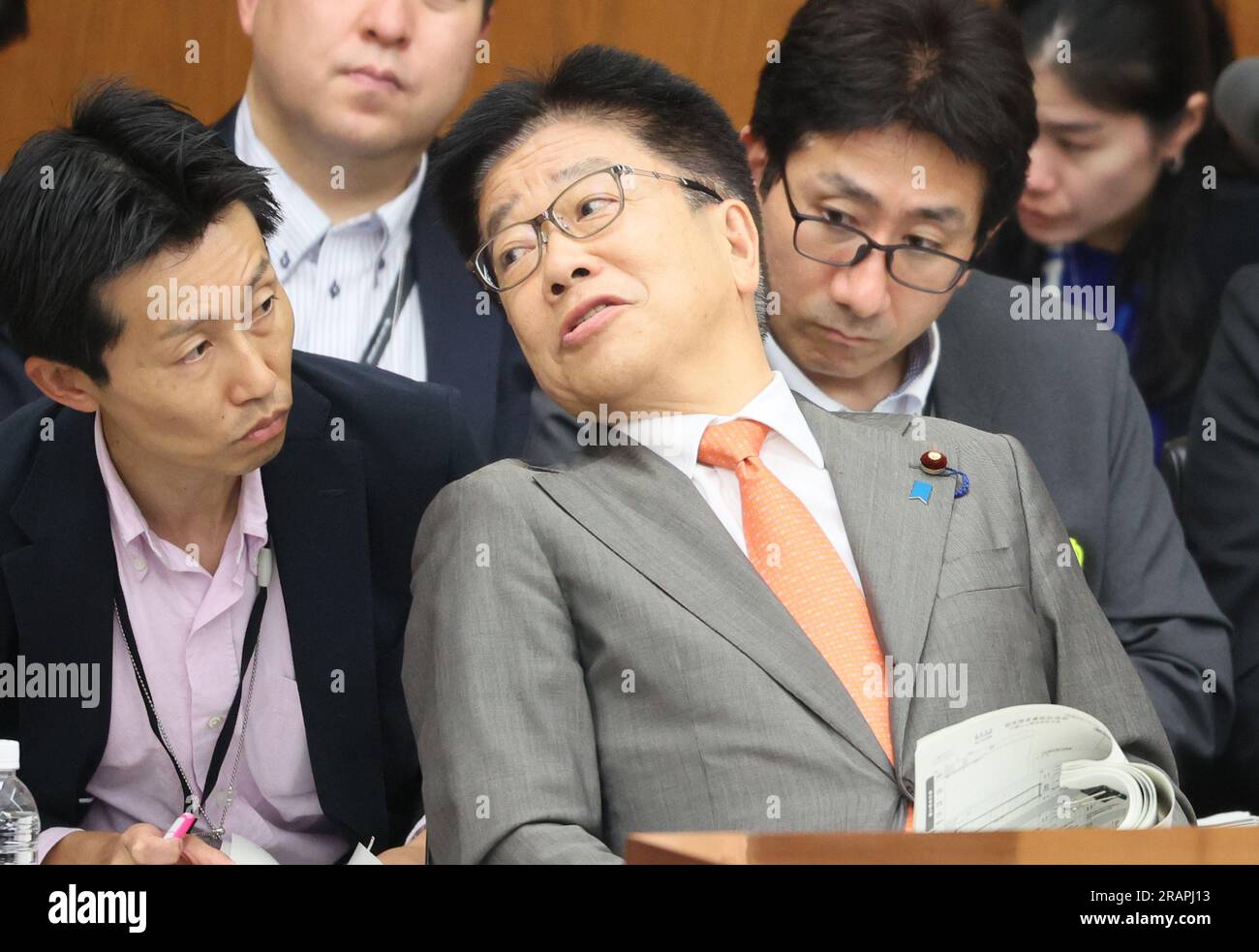 Tokyo, Japan. Wednesday. 5th July, 2023. Japanese Health Minister Katsunobu Kato (C) chats with his aide at Lower House's ad hoc committee to discuss 'My Number' ID card system at the National Diet in Tokyo on Wednesday, July 5, 2023. My Number card system has problem such as a person's health insurance number is linked to the another person's My Number ID card. (photo by Yoshio Tsunoda/AFLO/Alamy Live News Stock Photo