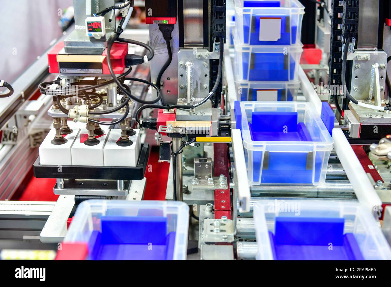 Automated storage warehouse with white plastic in production line ,modern parcels transportation system concept Stock Photo