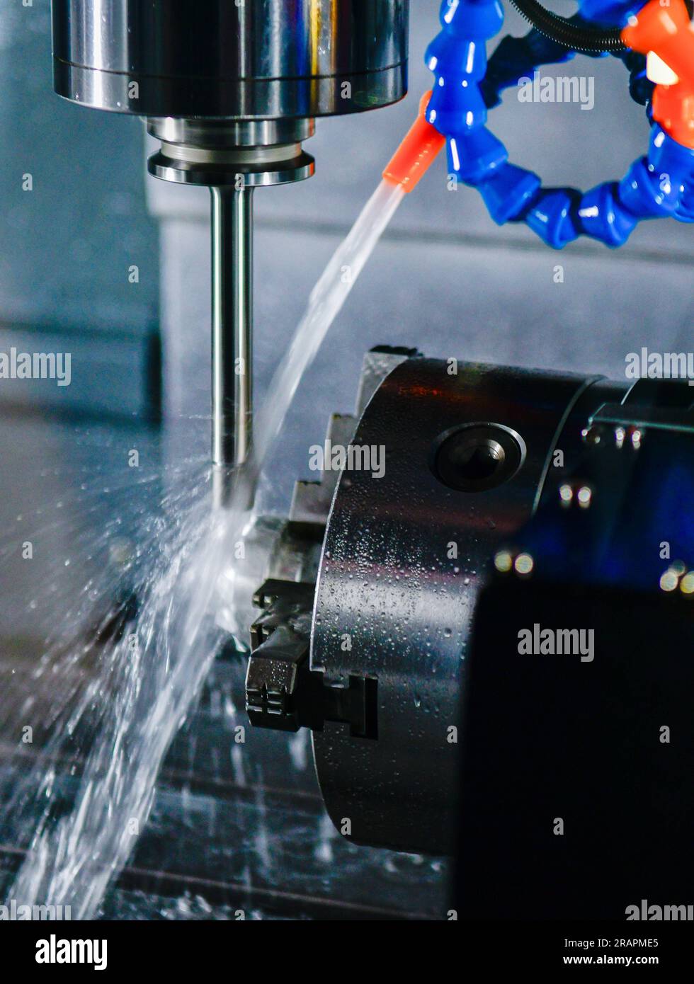 Metalworking CNC milling machine. Cutting metal modern processing Hi-technology machining concept. Stock Photo