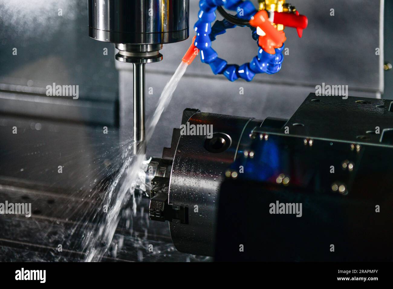Metalworking CNC milling machine. Cutting metal modern processing Hi-technology machining concept. Stock Photo