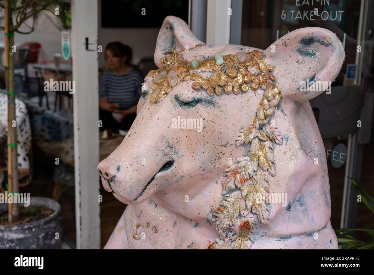 A statue of a bear sits outside of a cafe in Congleton, Cheshire East