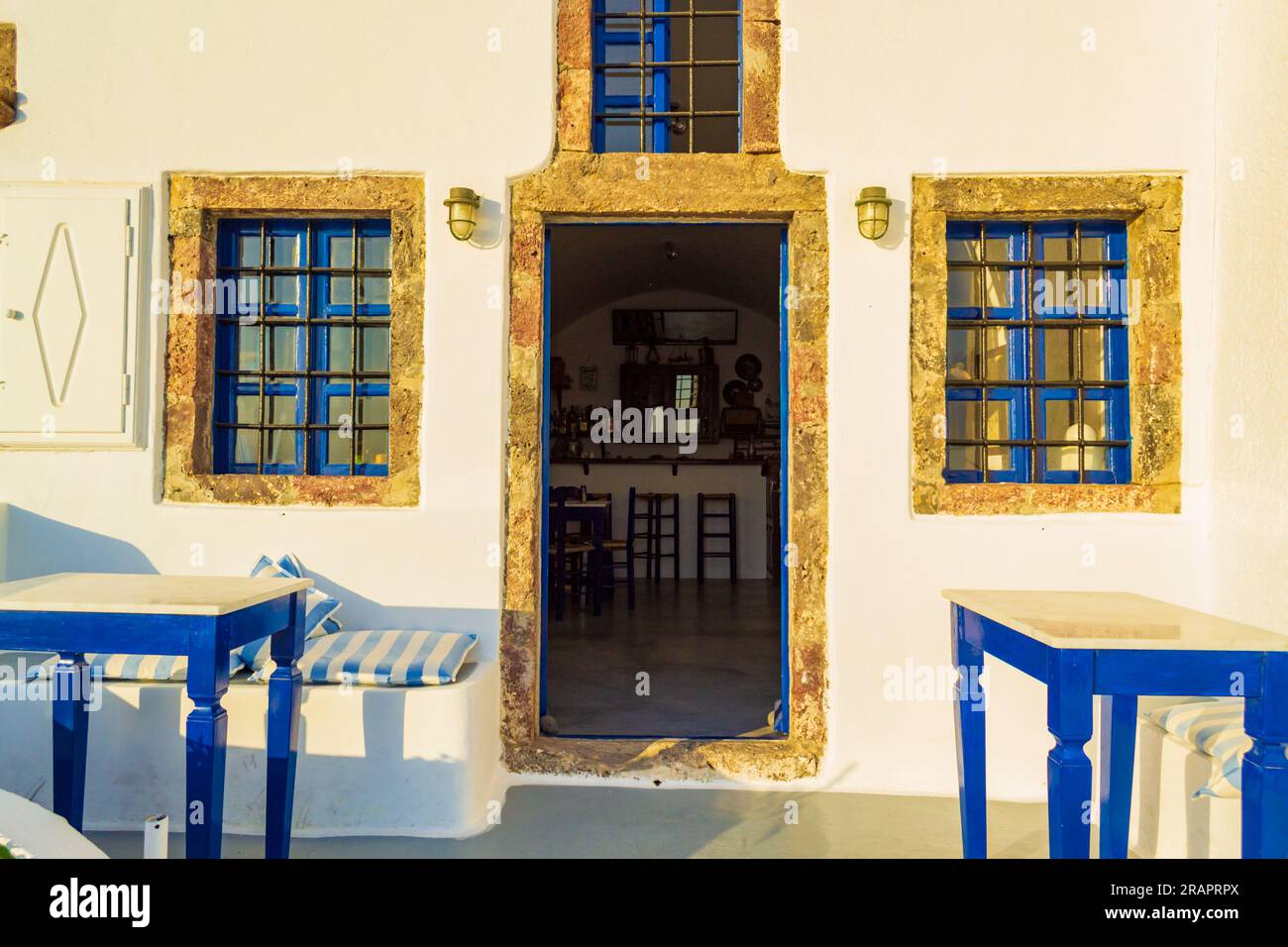 Enchanting old Greek taverna entrance , typical Cycladic architecture.Upscale Imerovigli village sits on a clifftop overlooking Santorini’s caldera Stock Photo