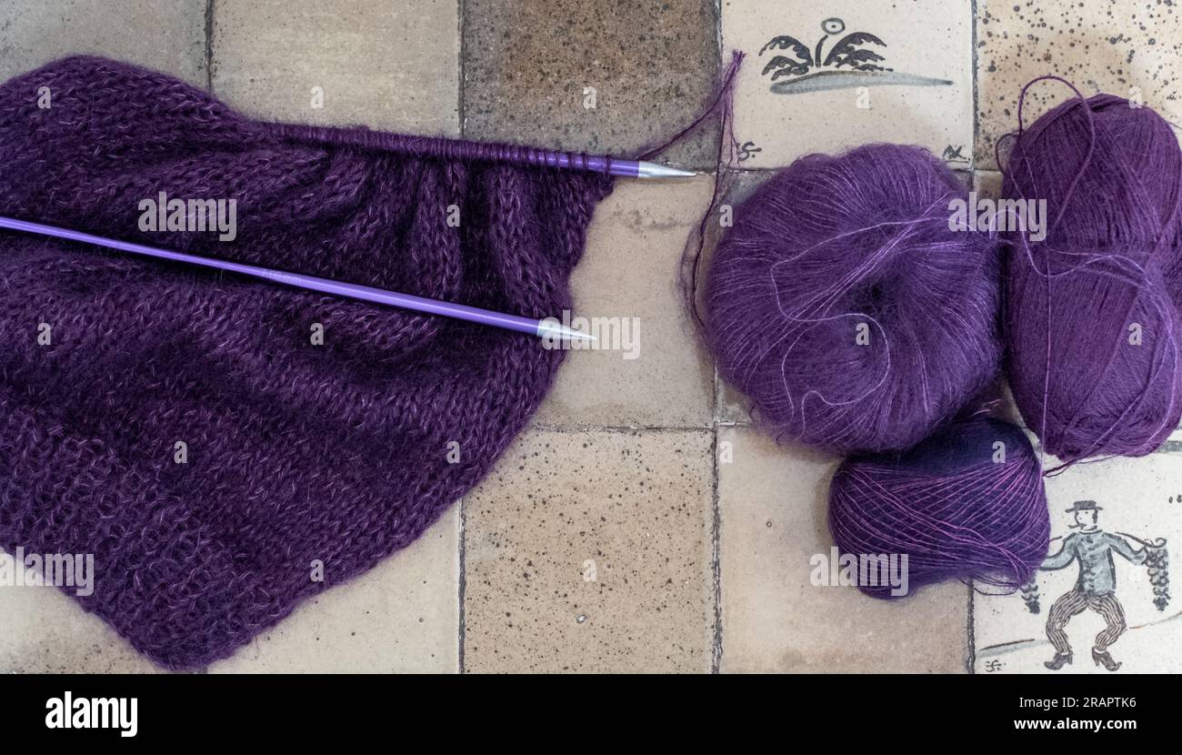 Close up of purple mohair and alpaca yarn hand knitted sweater 
