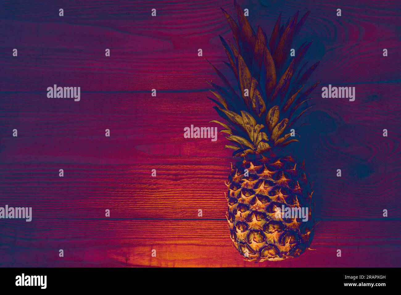 Neon pineapple background, flatlay. Healthy ftropical fruits diet