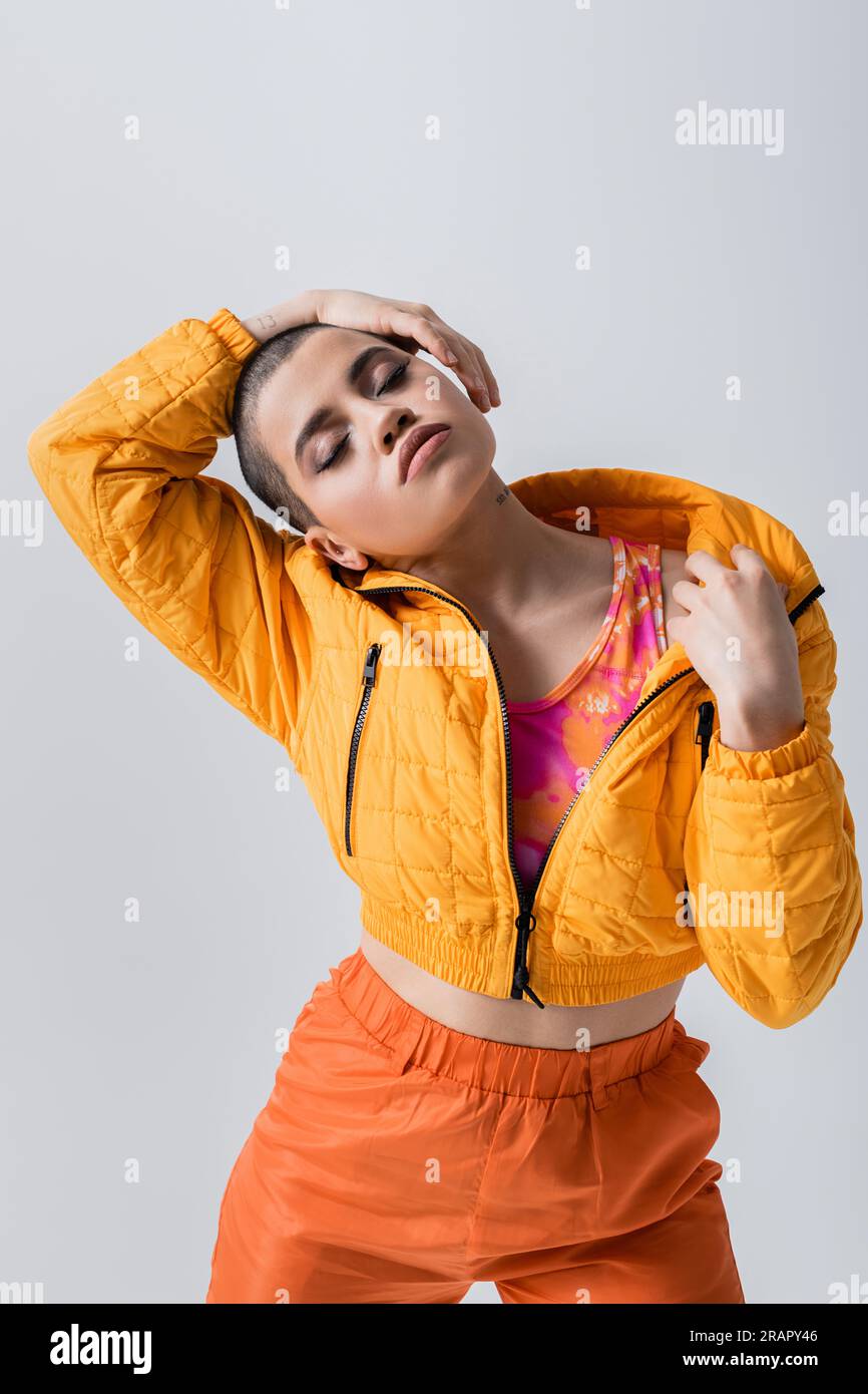 outerwear, individualism, fashion model posing with closed eyes, young ...