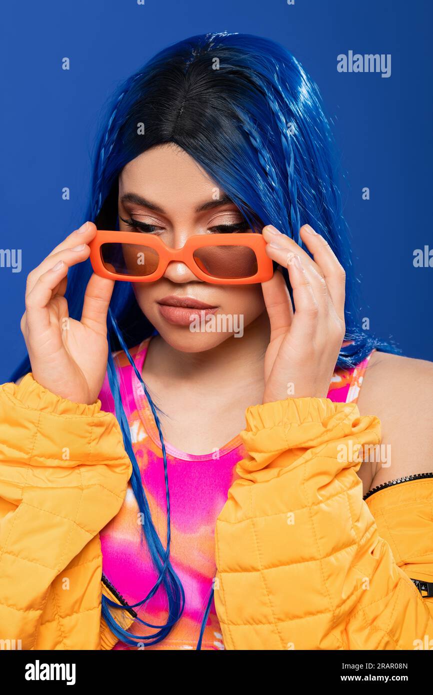 fashion statement, young female model with blue hair and braids wearing