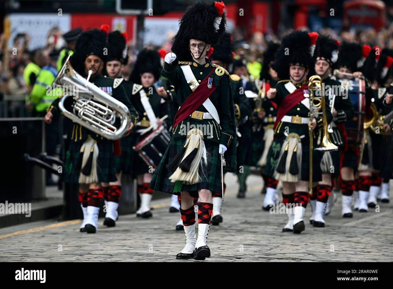 A military band leads the People's Procession, representing aspects of