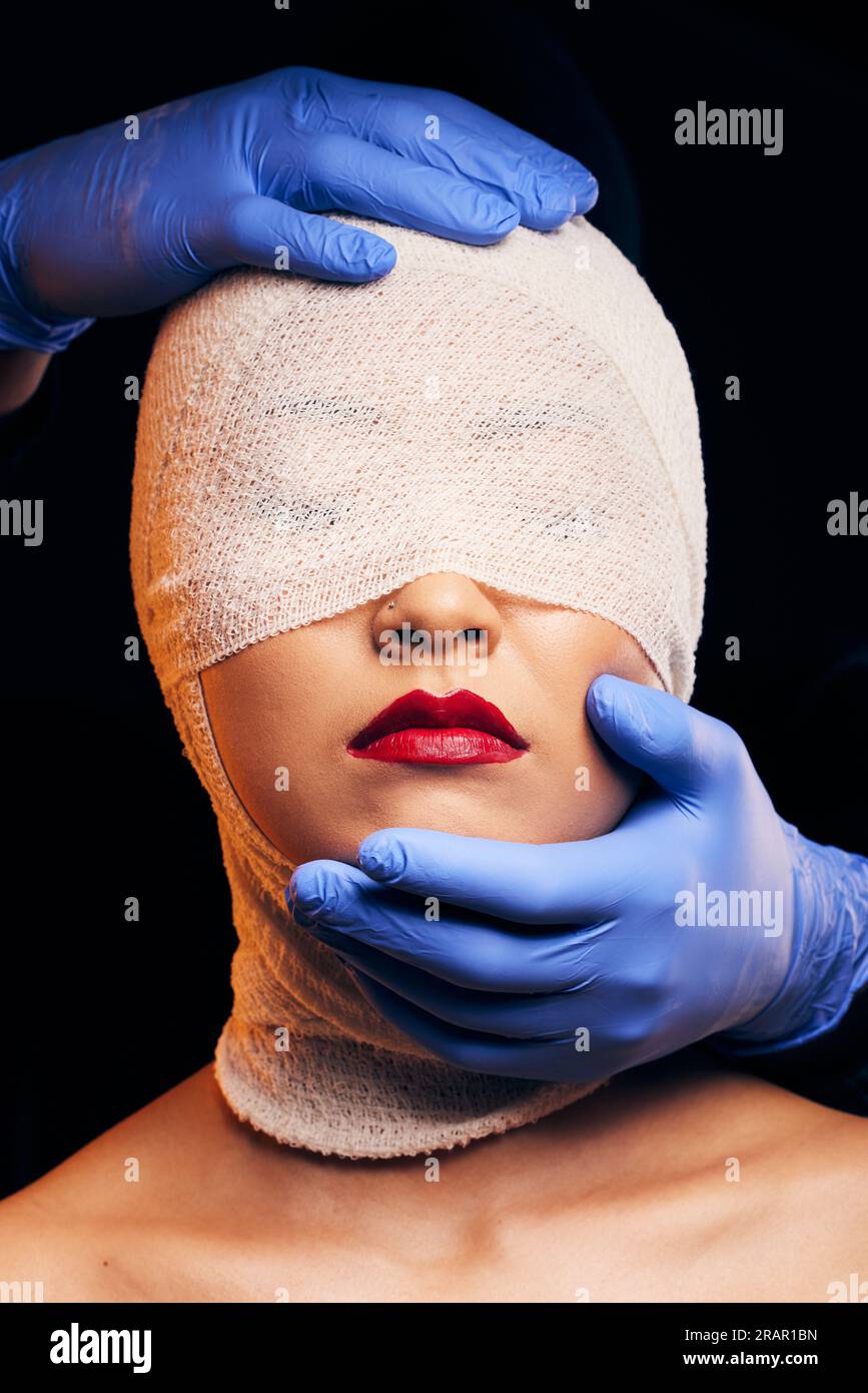 Plastic surgery, cosmetics and bandage on face of woman in studio for  beauty, skincare and dermatology. Aesthetic, makeup and transformation with  Stock Photo - Alamy