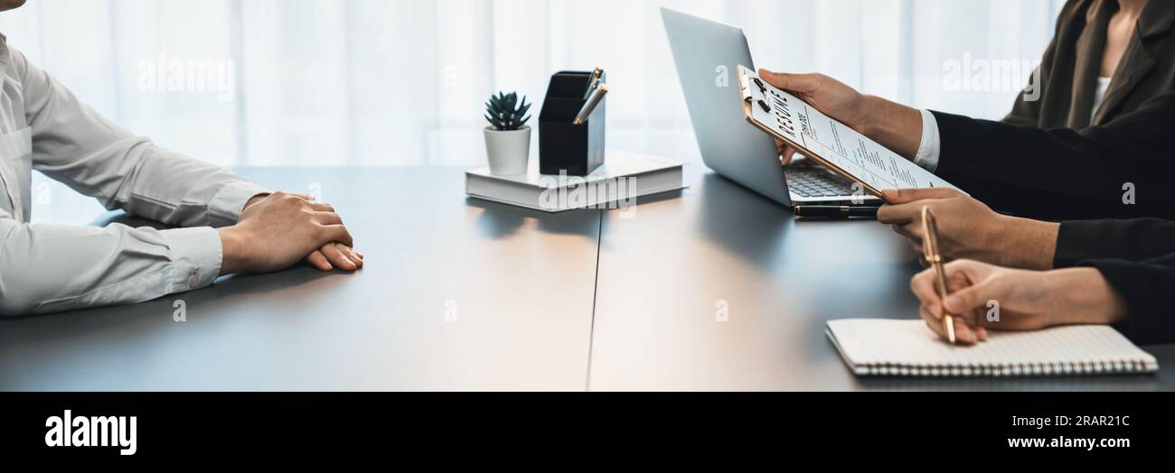 Candidate and interviewers discuss work experience and qualifications