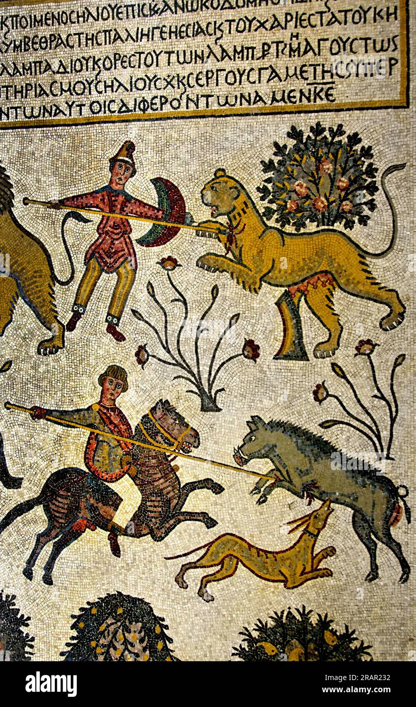 Mount Nebo Diakonikon-Baptistery Mosaic, Jordan, Jordany. Part of the Restored Antique Mosaic on the Floor in Memorial Church of Moses. Discovered in 1976, in the northern hall below a simple mosaic floor, the central mosaic of the Diakonikon Baptistery is a remarkable hunting and herding scene, interspersed with an assortment of African fauna, including a zebu (humped ox), lions, tigers, bears, boars, zebras, an ostrich on a leash and a camel-shaped giraffe. Stock Photo