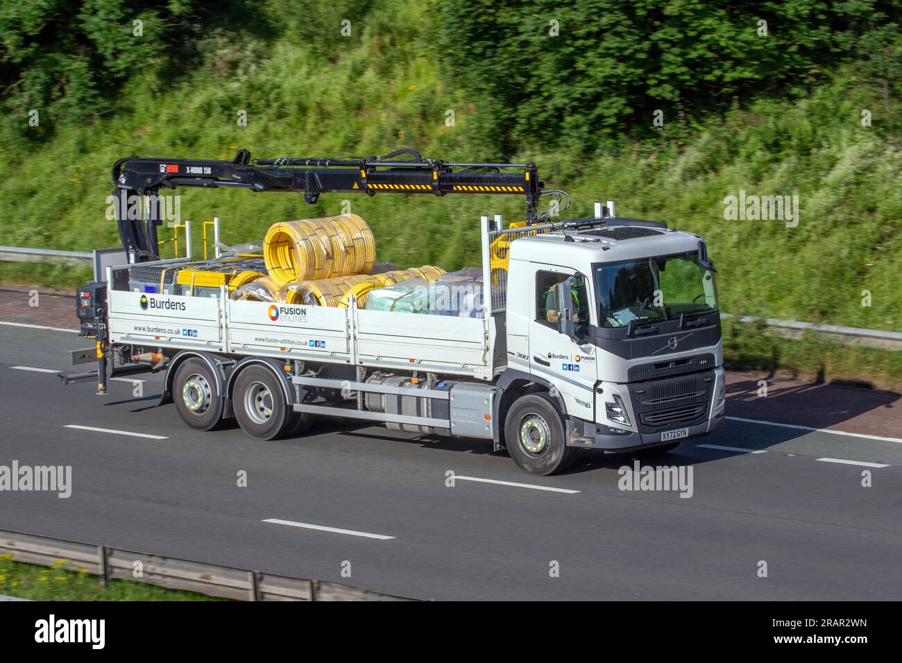 Burdens Fusion Utilities travelling 2023 Volvo Diesel 10837 cc lorry on the  M6 motorway in Greater Manchester, UK Stock Photo - Alamy