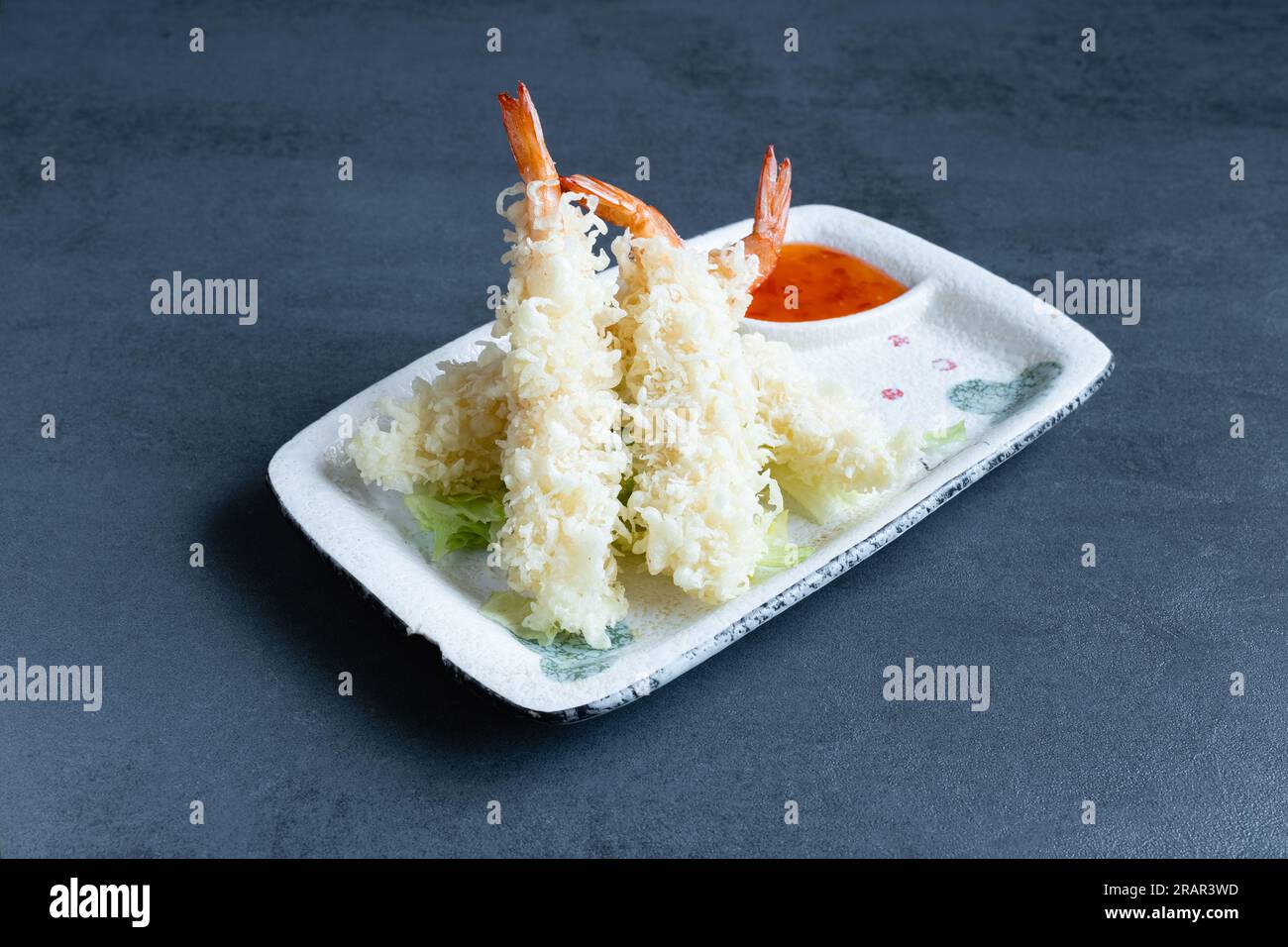 Sushi restaurant, view of a Japanese dish, Ebi Tempura with sauce Stock