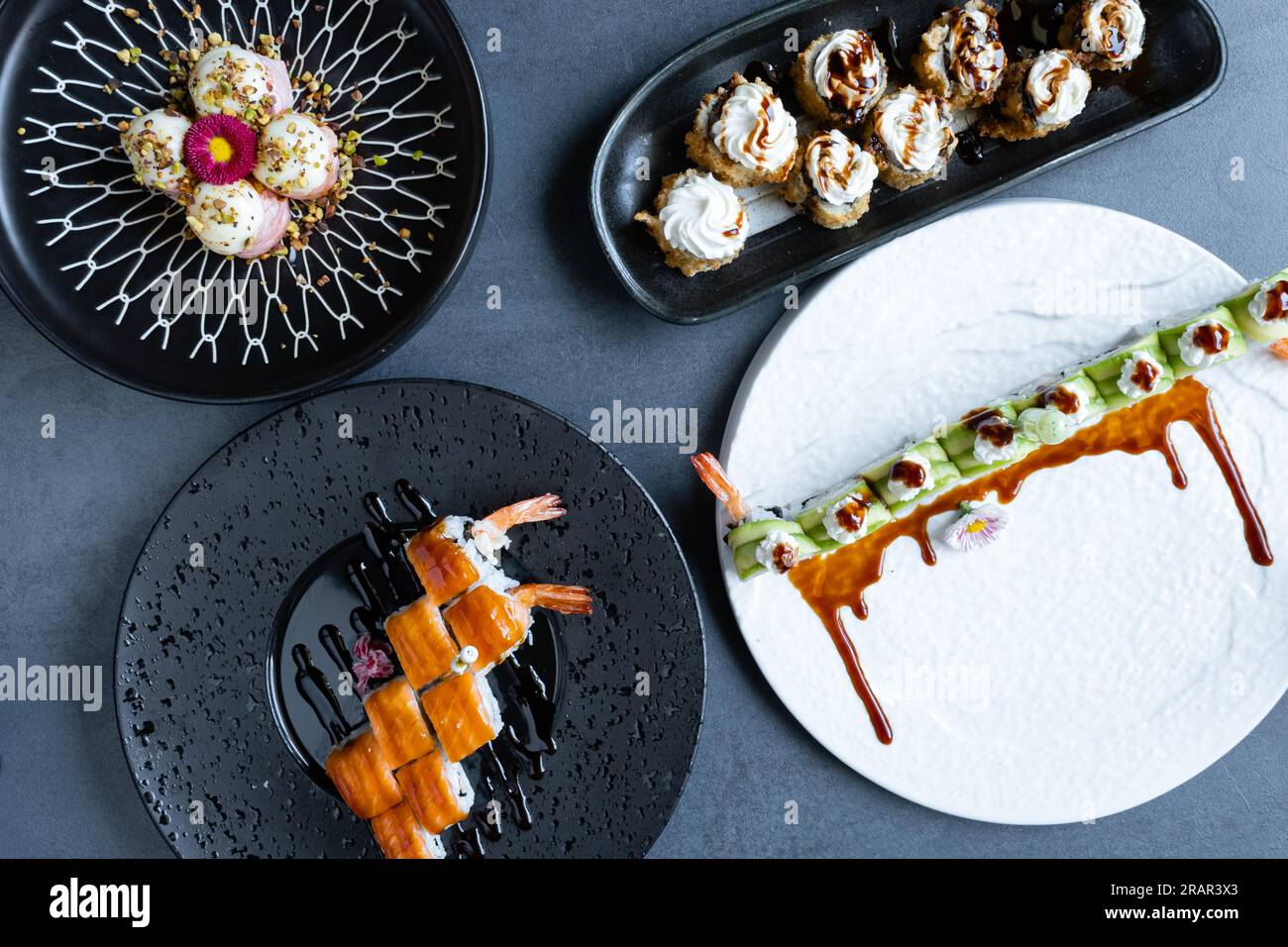 Sushi restaurant, top view of a mix of Japanese dishes. Stock Photo