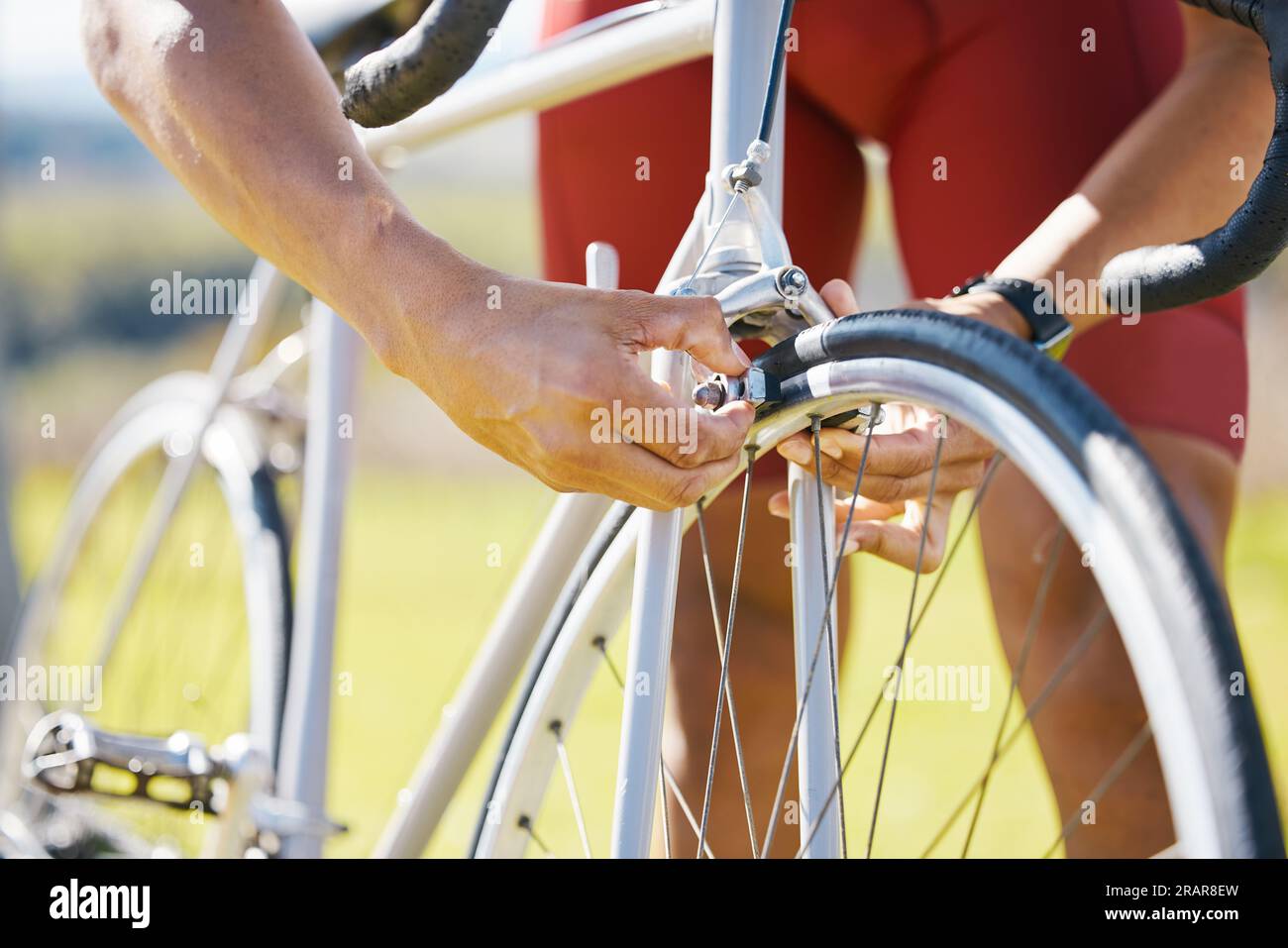 Bicycle, wheel and a man outdoor fixing puncture or problem while