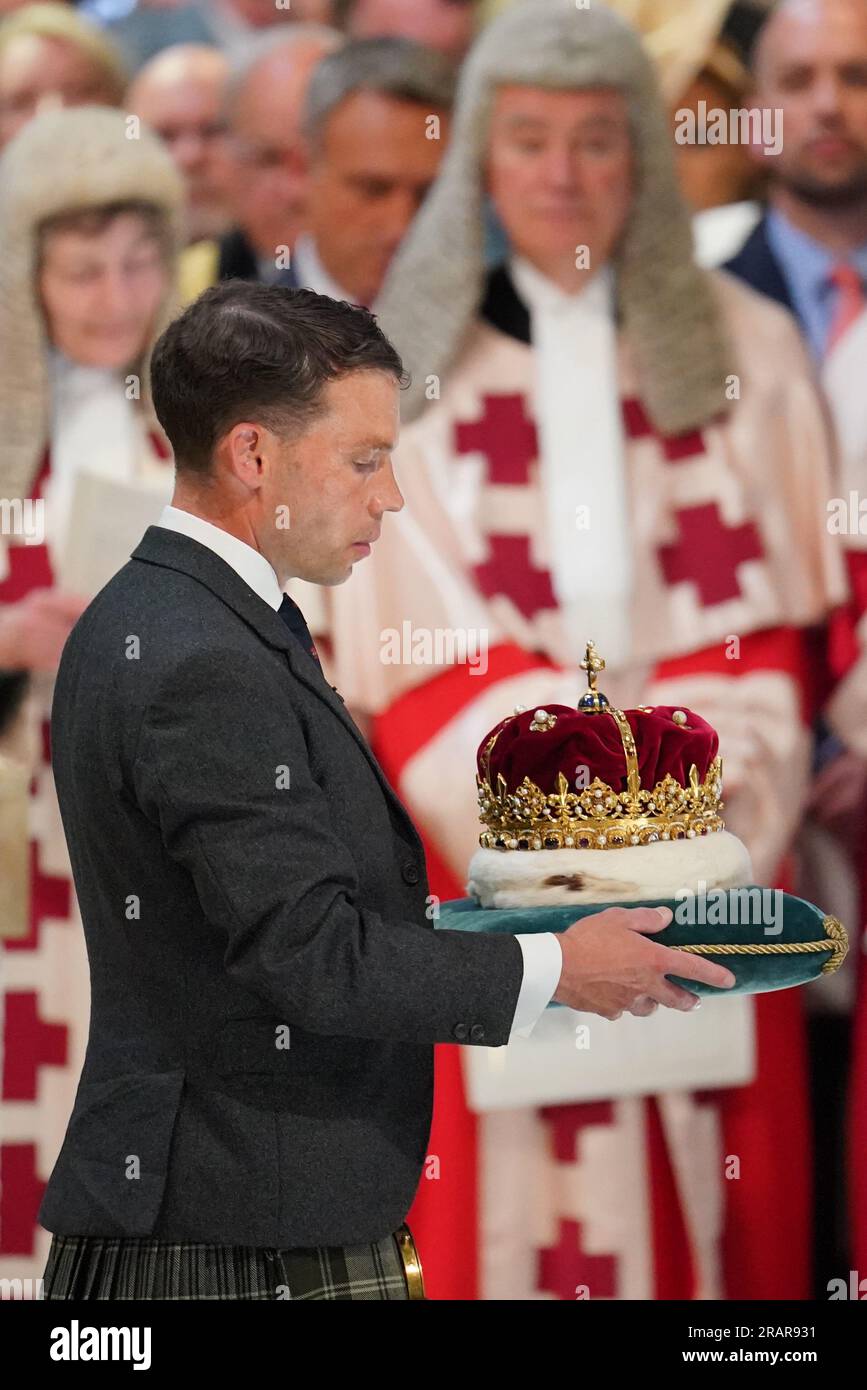 The Duke of Hamilton and Brandon carries the Crown of Scotland at the National Service of Thanksgiving and Dedication for King Charles III and Queen Camilla, and the presentation of the Honours of Scotland, at St Giles' Cathedral, Edinburgh. Picture date: Wednesday July 5, 2023. Stock Photo