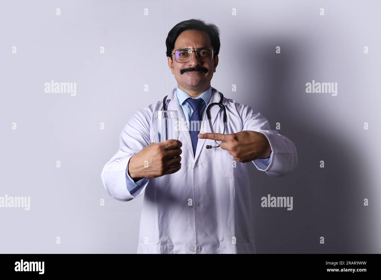 Doctor recommending nutritional diets and drinks for a better health. Stock Photo