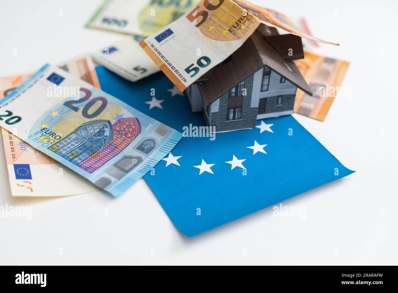 Real estate concept with Euro bank notes House and coins Stock Photo ...