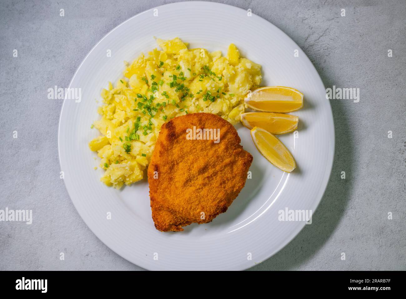 Chicken cutlet with couscous and lemon Stock Photo Alamy