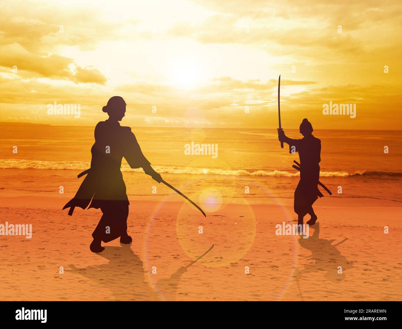 Two Samurai in duel stance facing each other on the beach Stock Photo