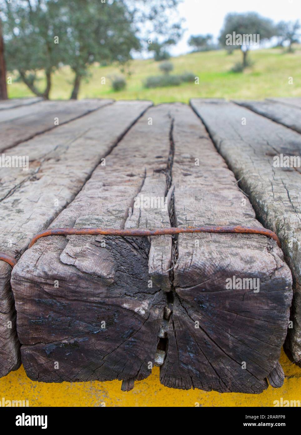 Old wooden sleepers reused for covering. Recycling construction materials concept. Stock Photo