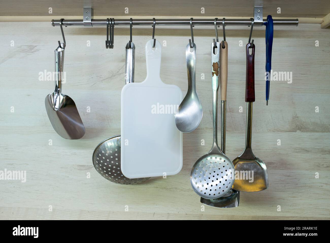 Kitchen utensils hanging in the kitchen Stock Photo Alamy