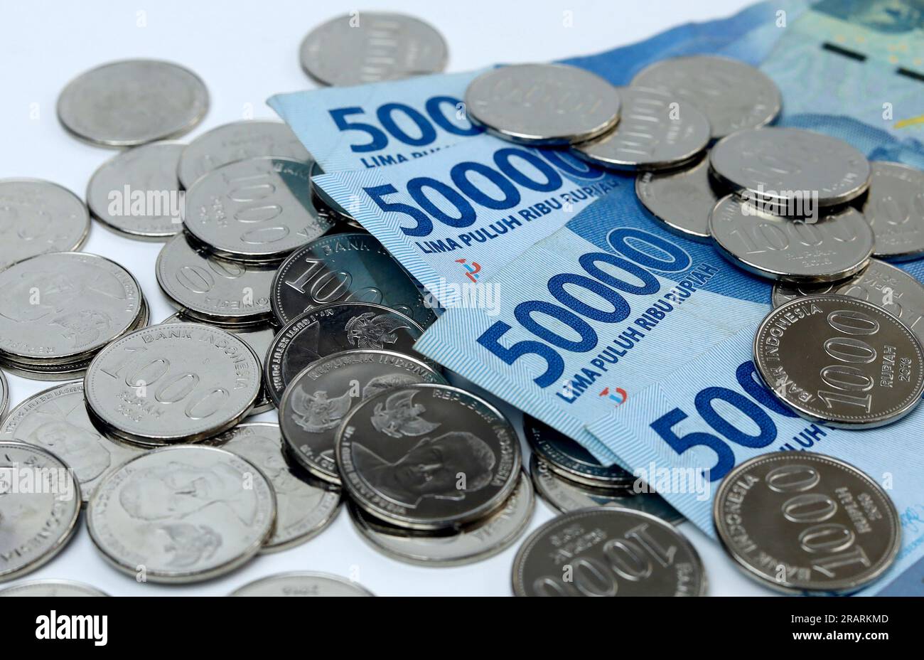 Coins and paper money with white background. Indonesian coin and paper currency Stock Photo