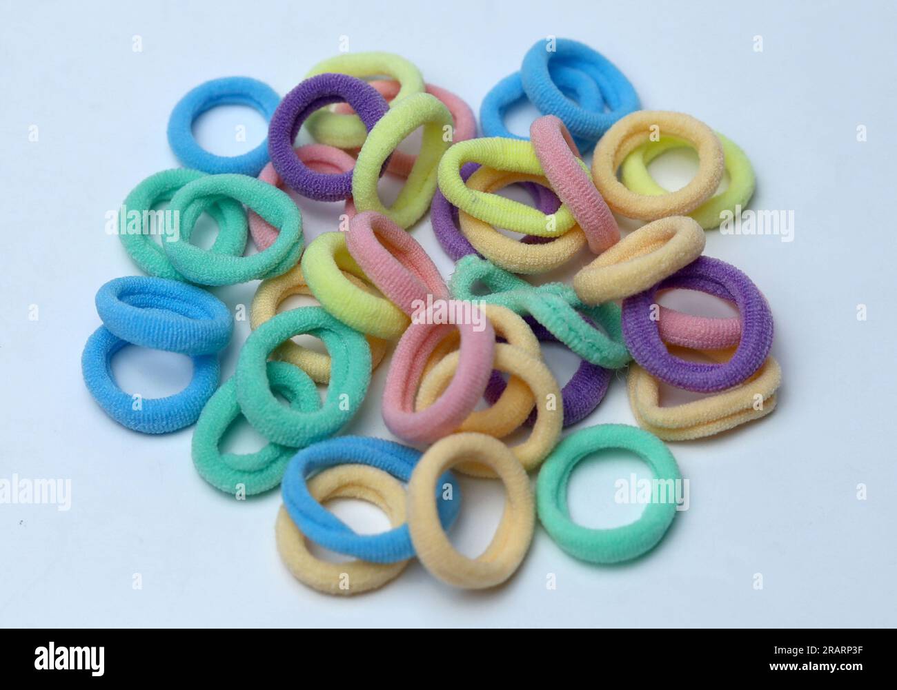 hair multicolored rubber bands or hair tie isolated on white background Stock Photo