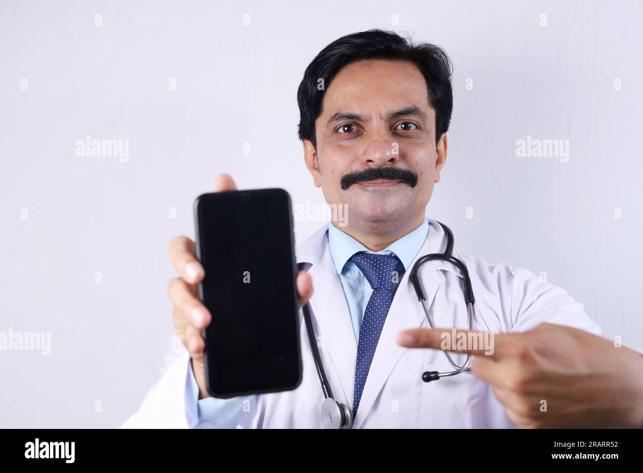 Beautiful portrait of happy Indian doctor in uniform wearing