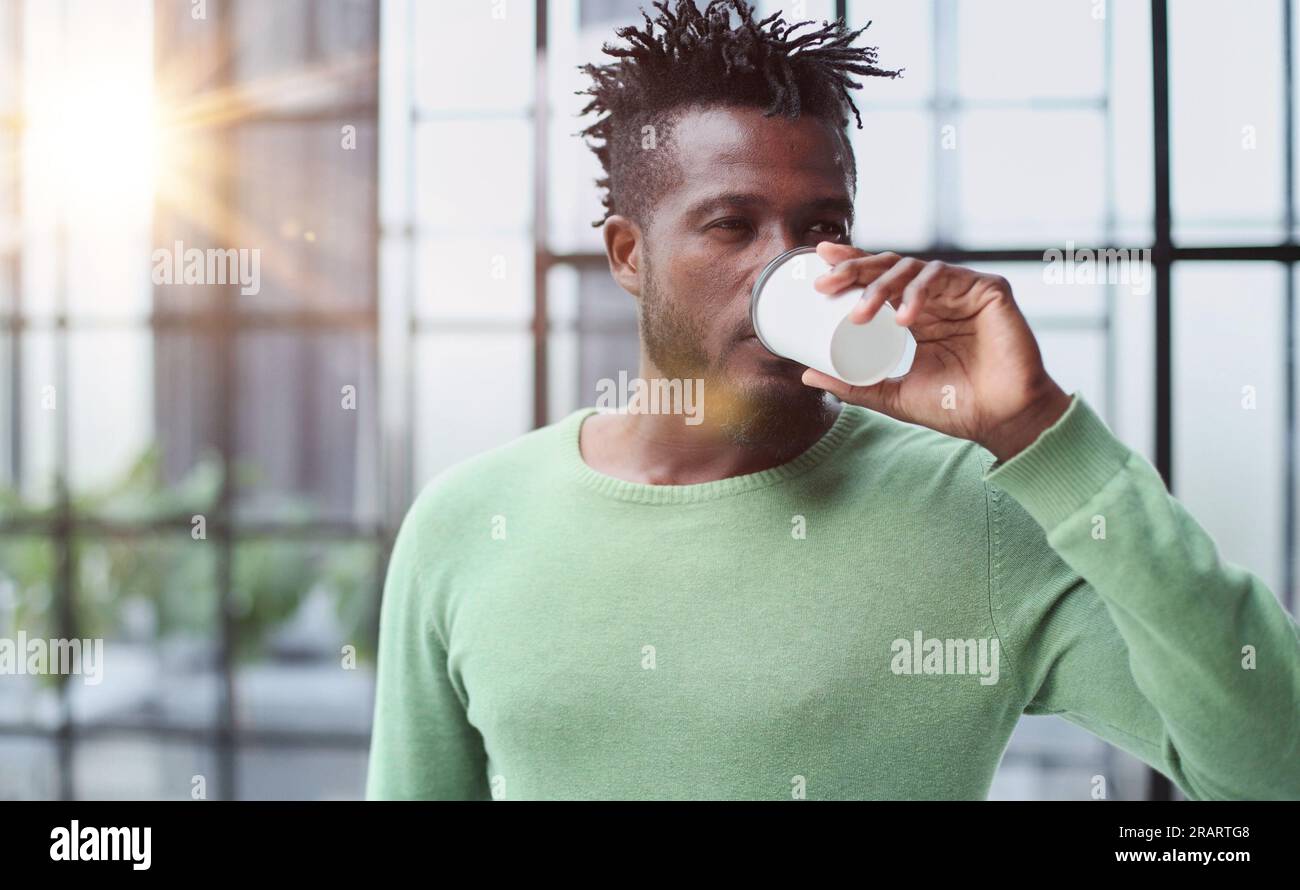 Smiling friendly handsome young male call centre operator. Stock Photo