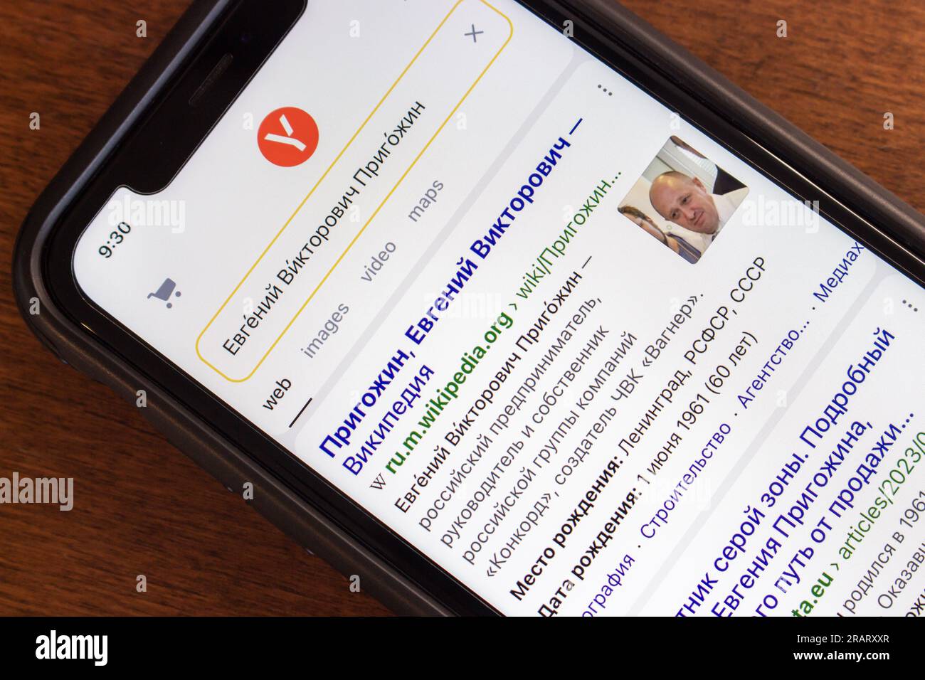 Search result of Yevgeny Prigozhin on Yandex website seen in an iPhone screen. Yevgeny Viktorovich Prigozhin is a Russian oligarch, mercenary leader Stock Photo