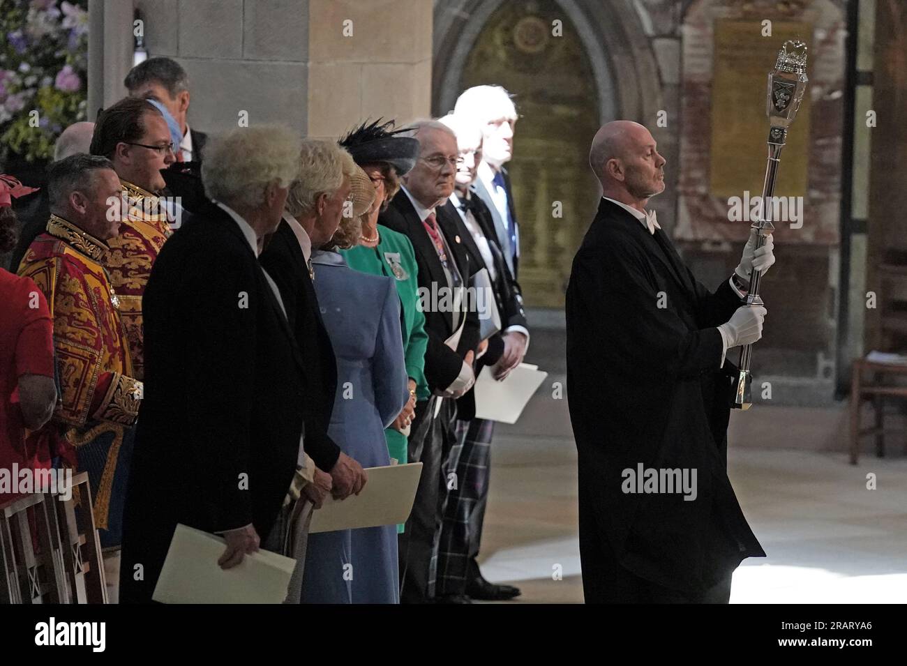 The ceremonial mace is carried ahead of the National Service of